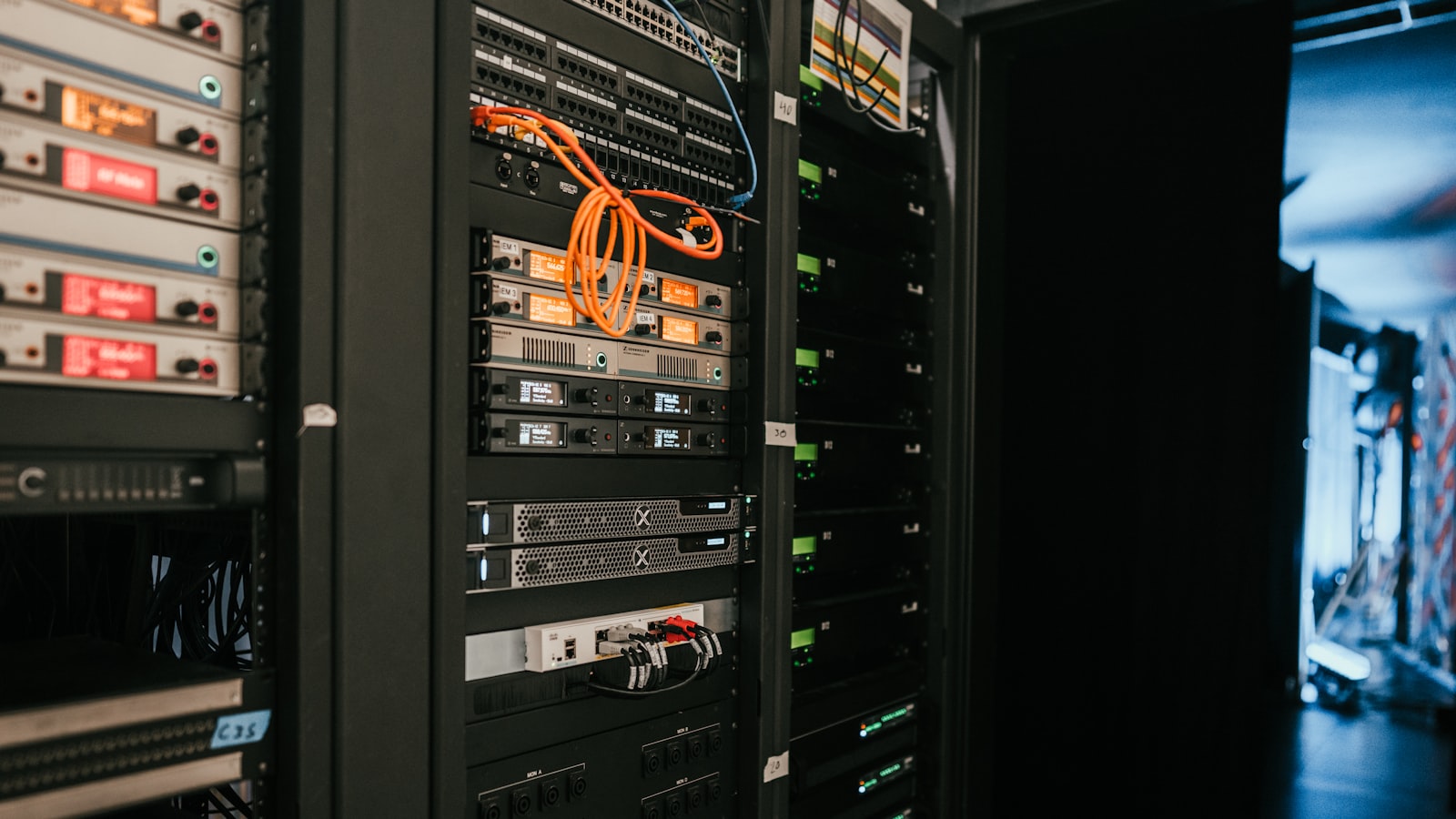 a rack of servers in a server room