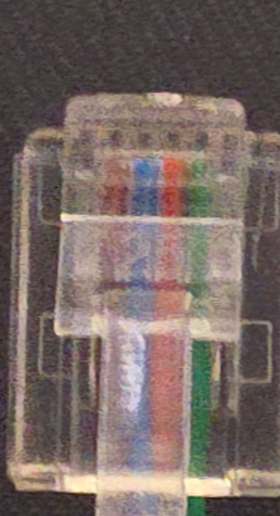 Transparent RJ11 6P4C plug with brown, blue, orange and green wires